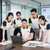 đồng phục công ty màu trắng phối tay xanh